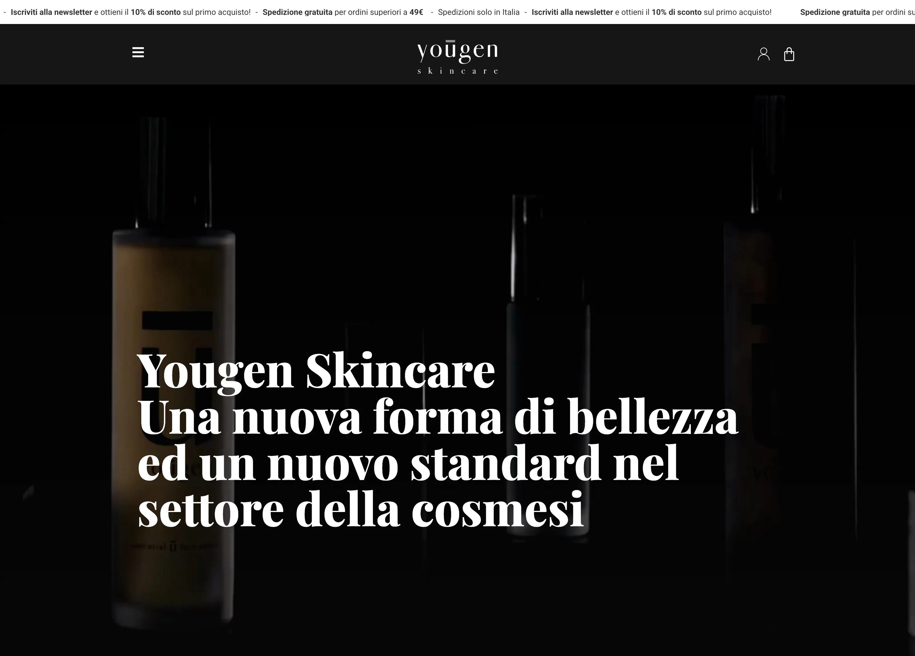 Chi siamo: i flaconi emergono dal buio sotto il manifesto del brand